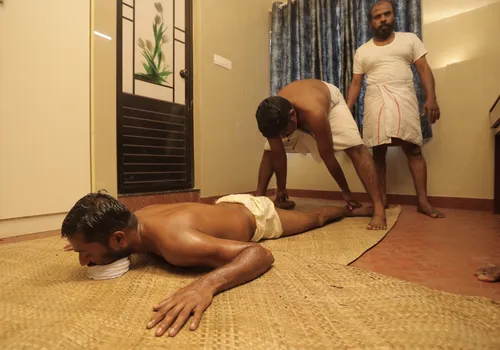 Marma treatment of the low back and sacral region for an L5-S1 disc bulge at Agasthya Ayurvedic Hospital, Kerala