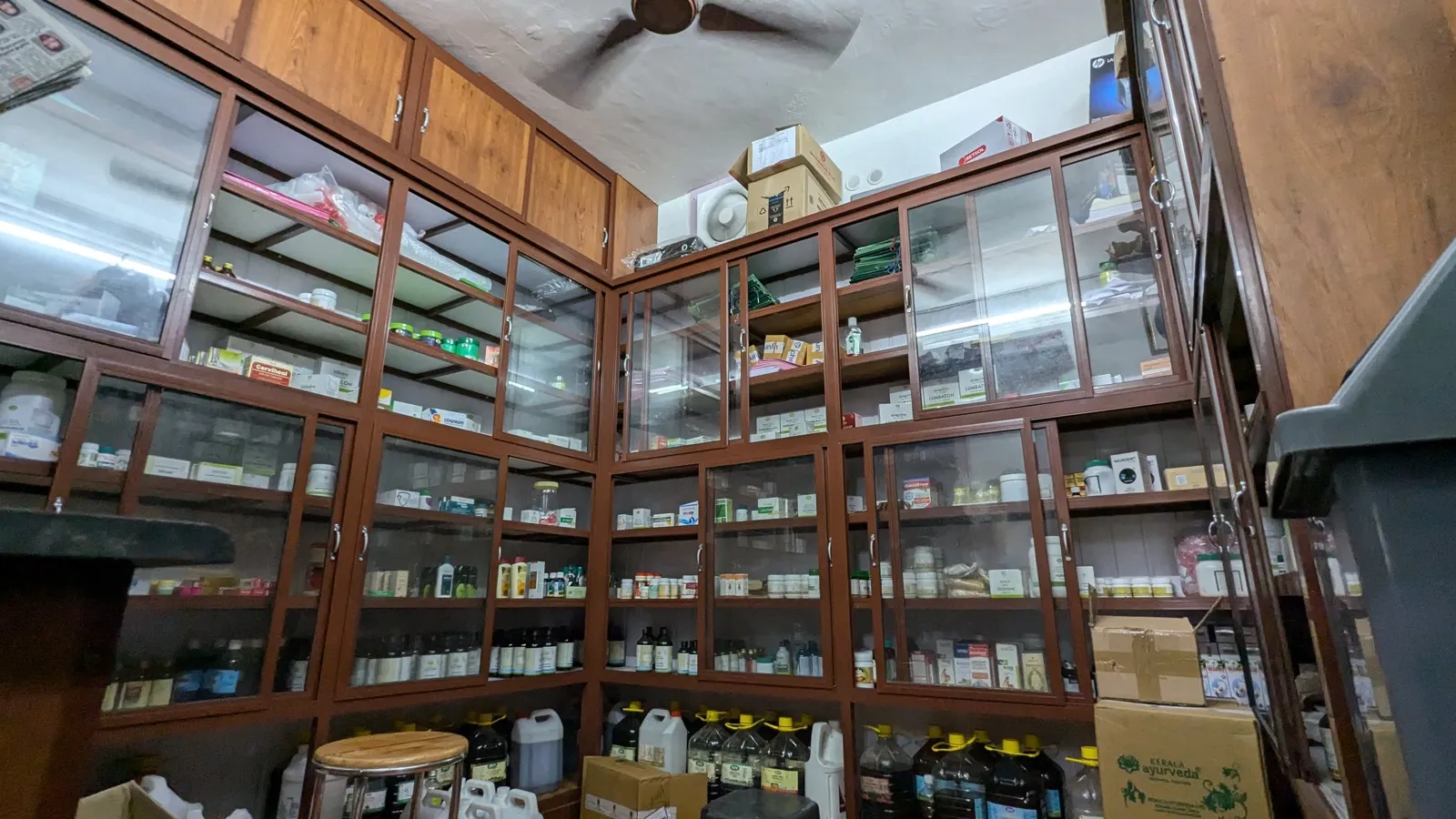 Ayurvedic medicine store with stocked shelves at Agasthya Ayurvedic Hospital