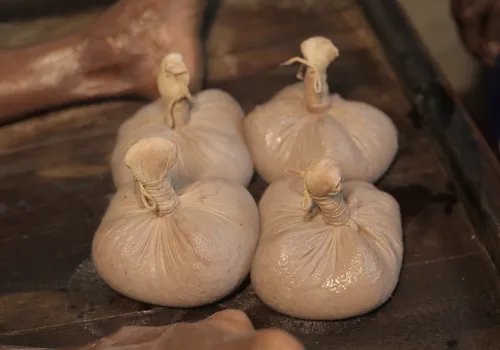 Njavarakizhi rice boluses prepared for knee ligament tear treatment at Agasthya Ayurvedic Hospital, Kerala