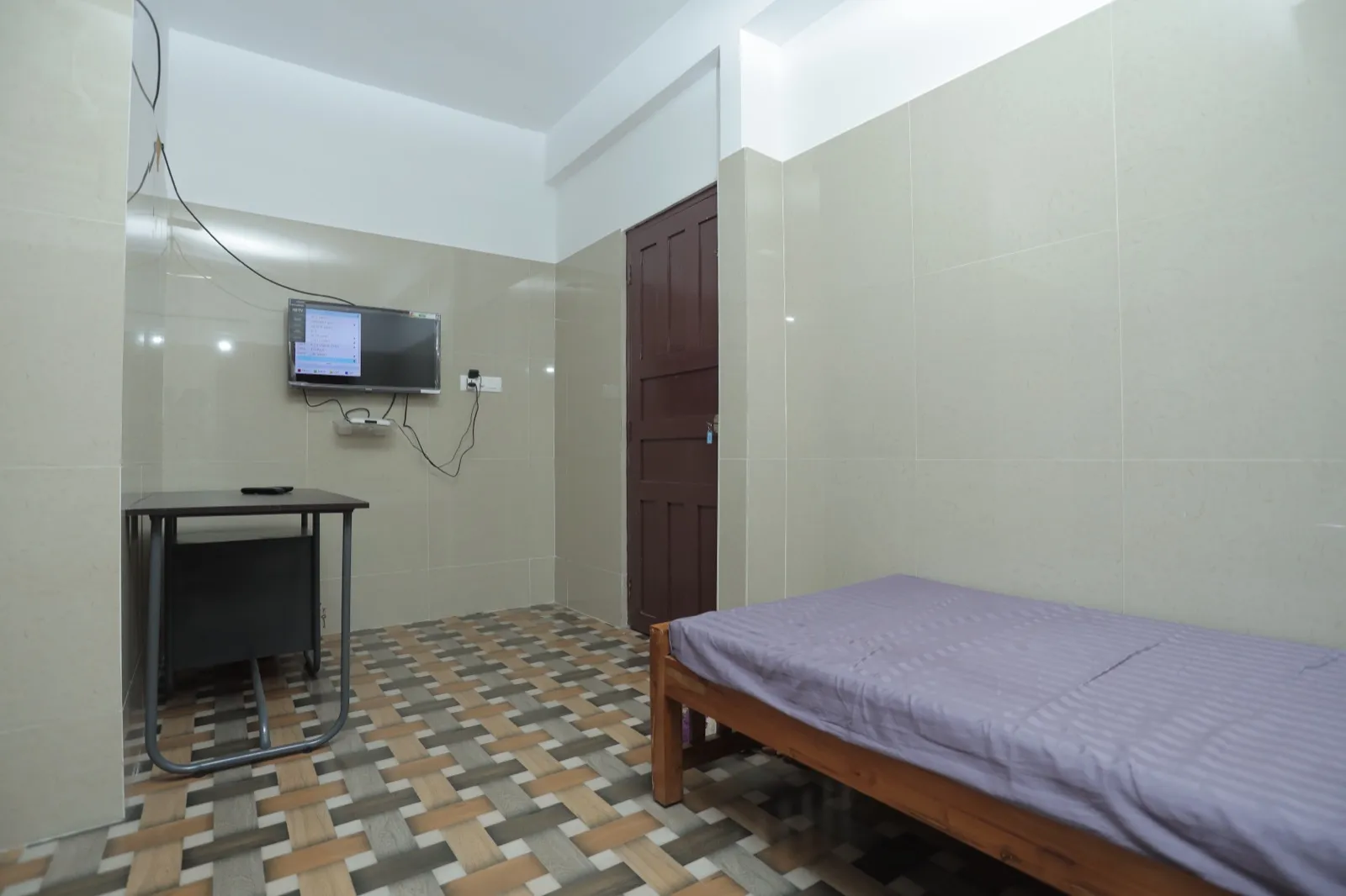 Single in-patient room with TV at Agasthya Ayurvedic Hospital, Ezhupunna