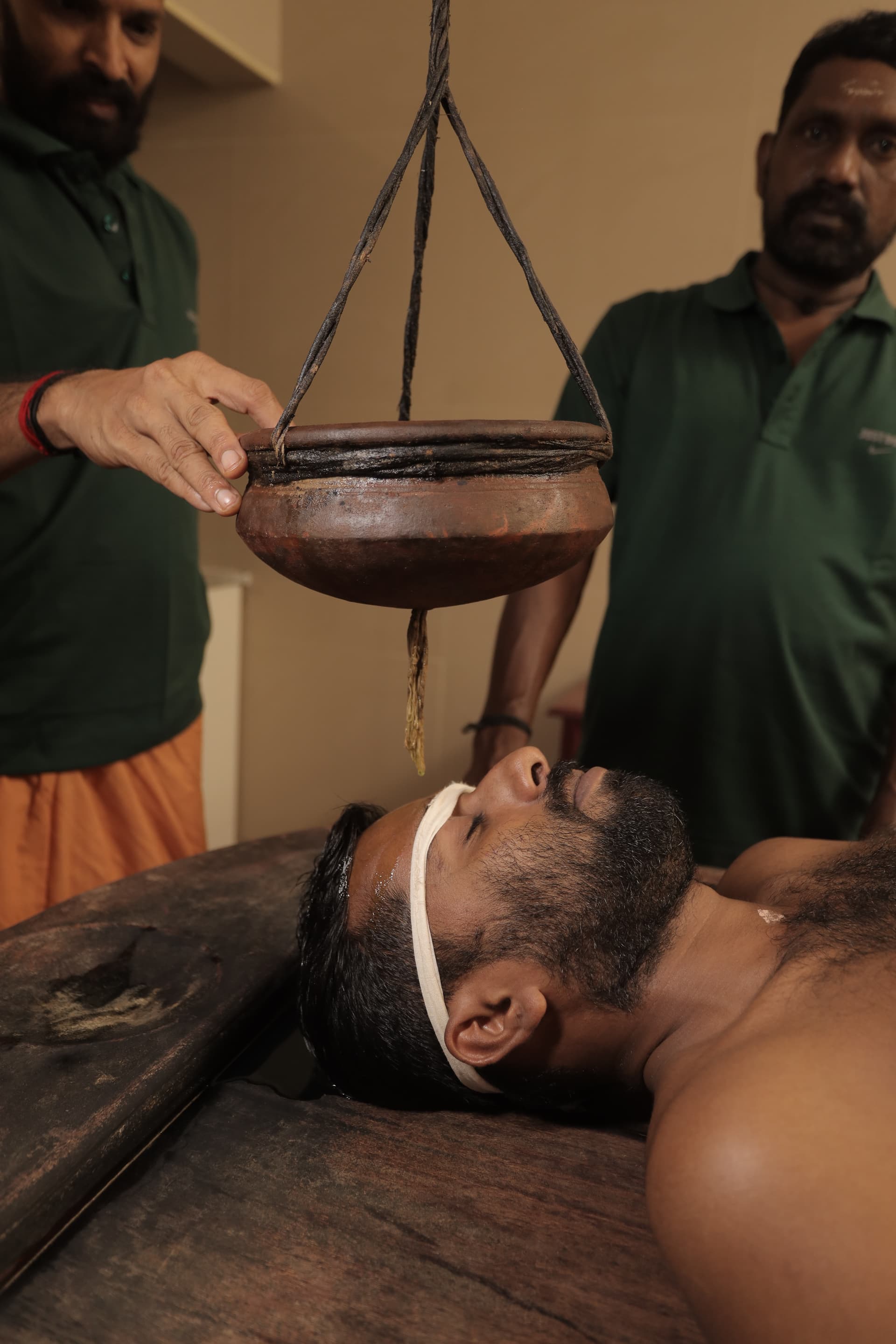 Traditional Shirodhara oil treatment